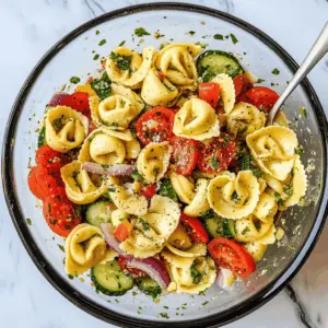 Brighten up your meal with this delicious Tortellini Pasta Salad! Packed with colorful veggies and topped with a zesty dressing, it’s perfect for summer picnics or quick lunches. The cheesy tortellini adds a satisfying twist that everyone will love. Save this recipe for your next gathering or a light family dinner!