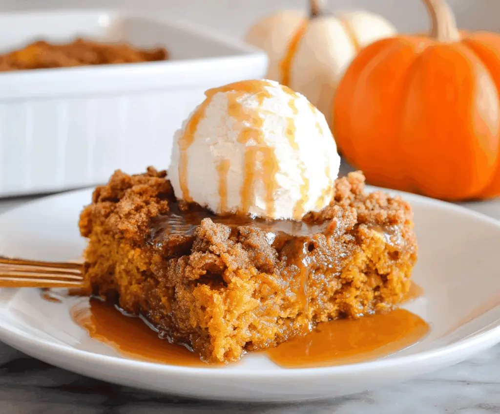 Delicious Pumpkin Dump Cake with a golden crust and moist pumpkin filling, perfect for fall desserts.