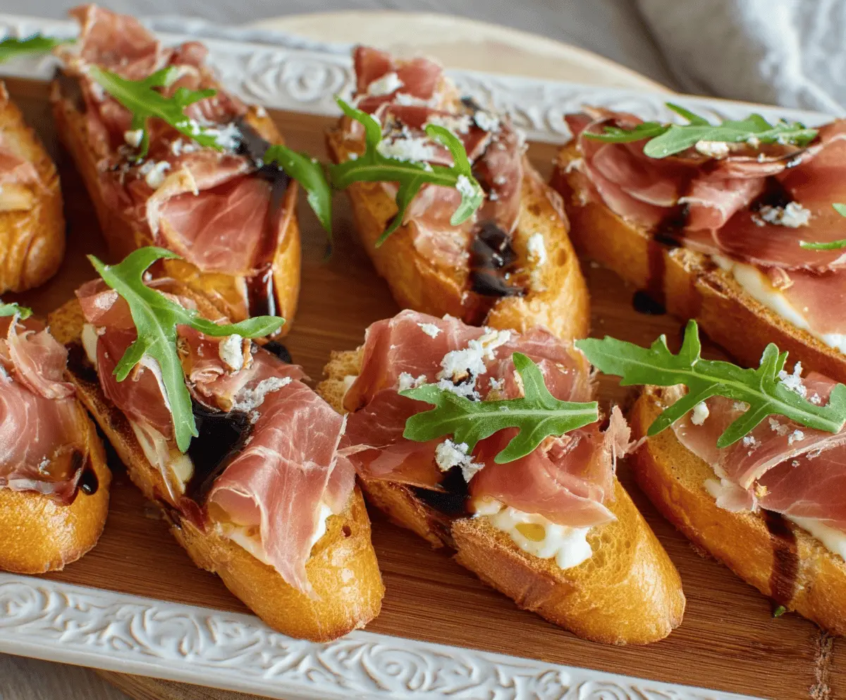 Delicious Brie and Prosciutto Crostini served on a rustic platter for appetizer.
