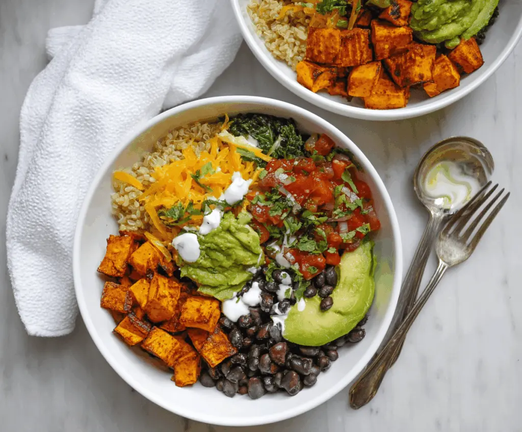 Delicious Chipotle Sweet Potato Burrito Bowl with colorful vegetables and fresh toppings.