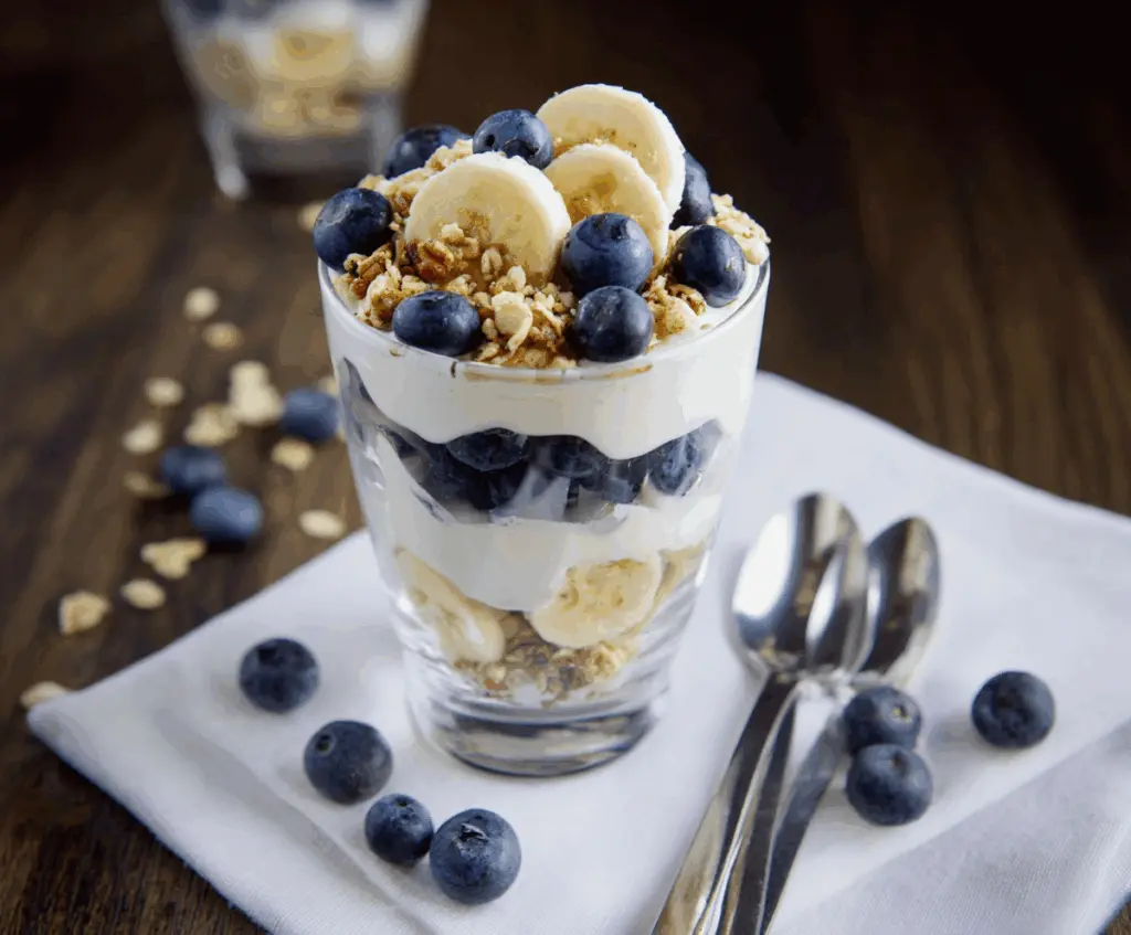 Delicious blueberry banana yogurt parfait layered with fresh fruits and creamy yogurt.