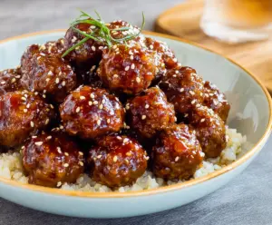 Delicious honey garlic meatballs served on a plate, perfect for a flavorful appetizer or main dish.