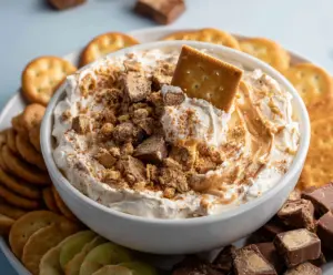 Delicious Butterfinger Dip in a bowl, perfect for dipping fruits and pretzels.