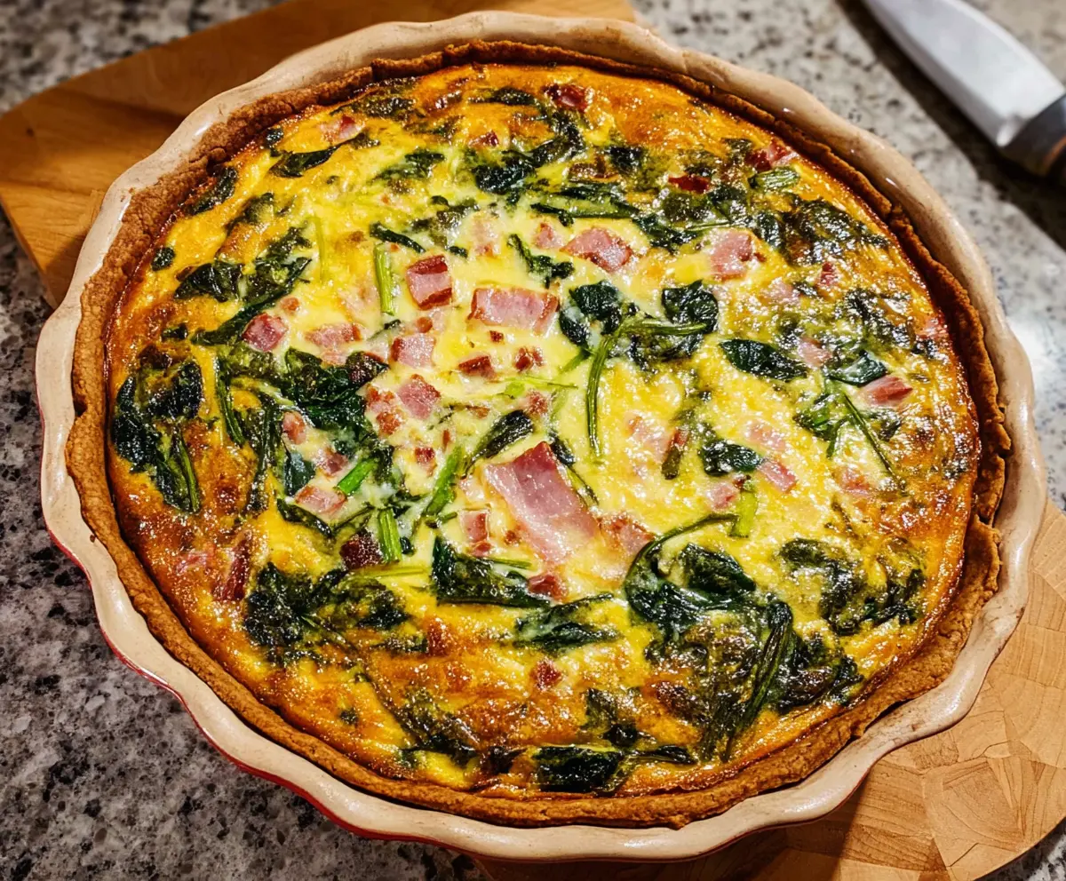 Delicious Easter Ham and Spinach Quiche served warm with fresh herbs