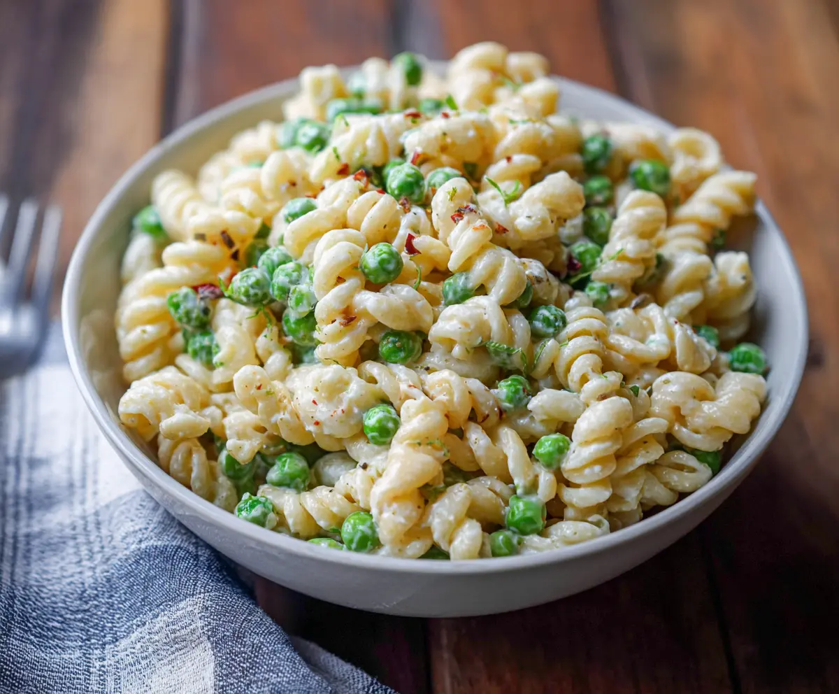 Vibrant English Pea Pasta Salad with fresh herbs and colorful vegetables
